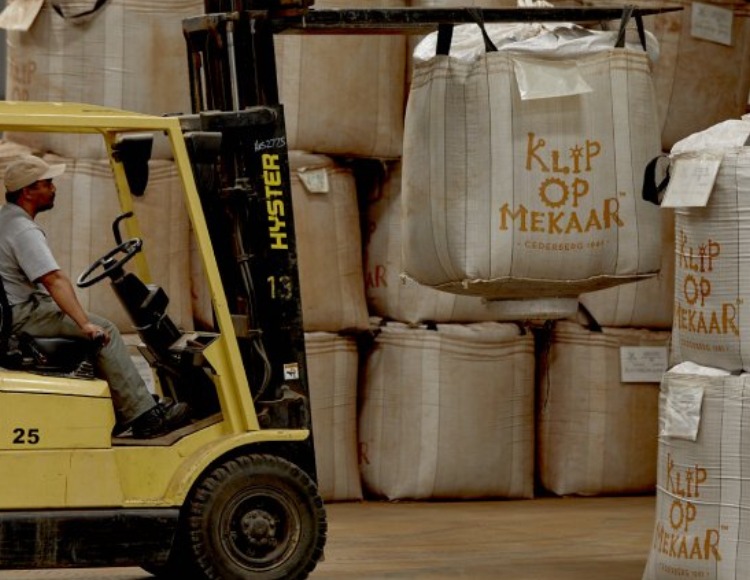 man driving forklift with bulk rooibos bag