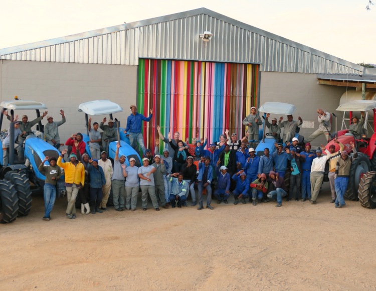 rooibos tea staff standing outside warehouse